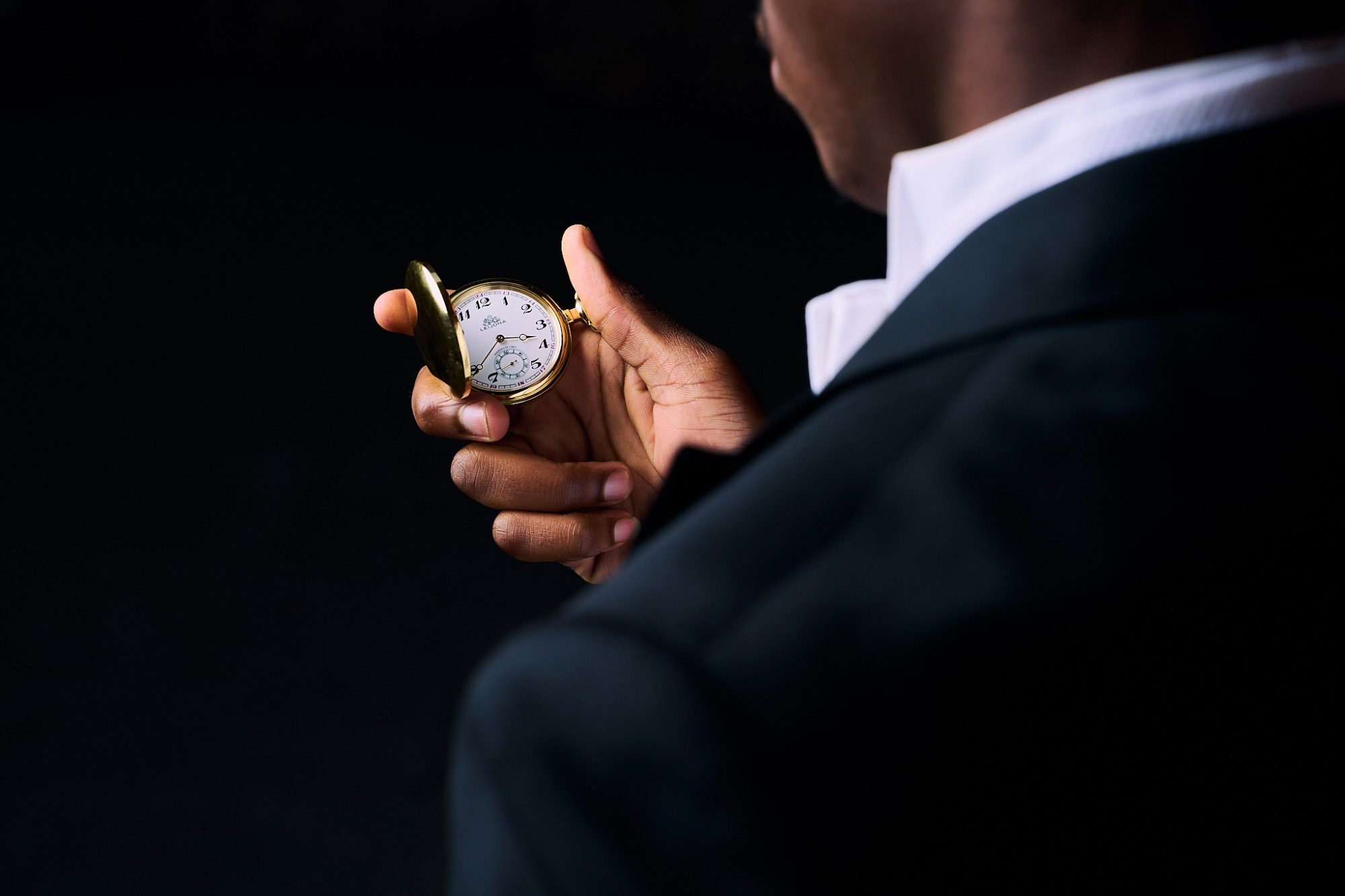 Product photography: tailcoat and gold pocket watch